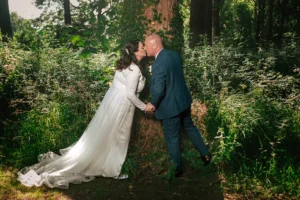 Wedding couple kiss during the mini session at the Betsey Wynne