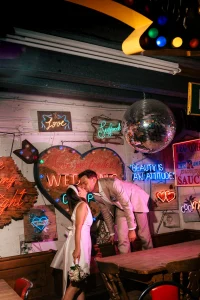Couple & LED lightboxes at Gods Own Junkyard industrial estate, Shernhall Street E17