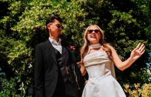 Cinematic editorial portrait of the newlyweds in Manchester square Park on a street near the Marylebone registry office.
