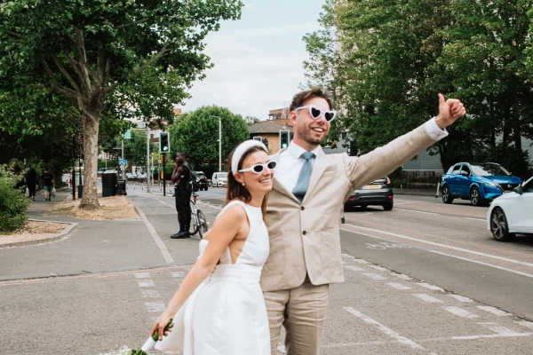Every frame is a story Walthamstow Forest Town Hall photographer captures a couple outside the venue Love and laughter Waltham Forest Town Hall wedding photographer capturing couple outside the registry office