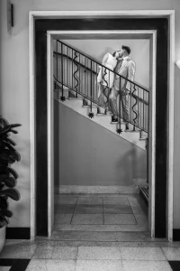 Where architecture meets emotion - registry office Walthamstow Town Hall photos shows editorial portrait of a couple on the iconic Walthamstow Town Hall stairs