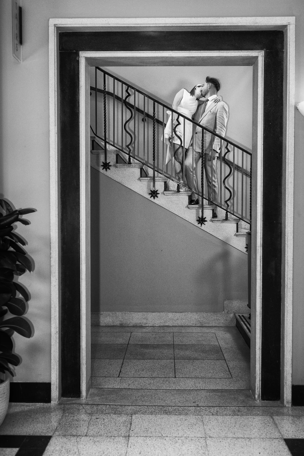Where architecture meets emotion - registry office Walthamstow Town Hall photos shows editorial portrait of a couple on the iconic Walthamstow Town Hall stairs