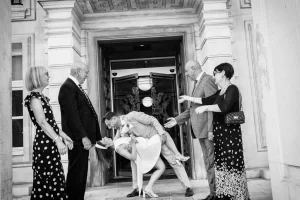 Walthamstow wedding photographer capturing an emotional couple's exit from the Fellowship Civic Chamber, Waltham Forest Town Hall Walthamstow