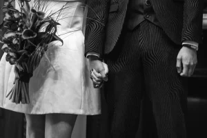 Close-up of the hands shared during an intimate Old Marylebone Town Hall ceremony