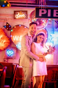 Bride and groom engagement shoot, neon signs Walthamstow