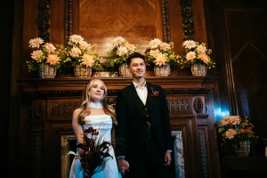 One partner smiling while listening to the wedding vows at Old Marylebone Town Hall in Marylebone room.