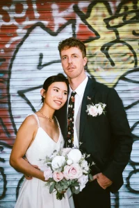 Editorial portrait of the newlyweds outside Camden Town Hall on Judd Street.