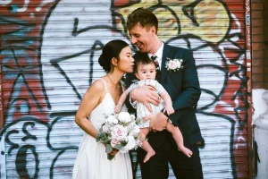 Editorial portrait of the newlyweds outside Camden Town Hall on Judd Street captured by editorial wedding photographer gregory Kowalski
