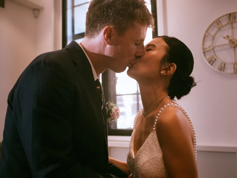 First Kiss Camden Town Hall Wedding Newlyweds sharing their first kiss during their Camden Town Hall wedding.