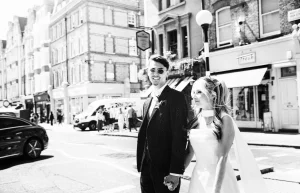 Newlyweds beginning an editorial portrait walk through the streets around Old Marylebone Town Hall.